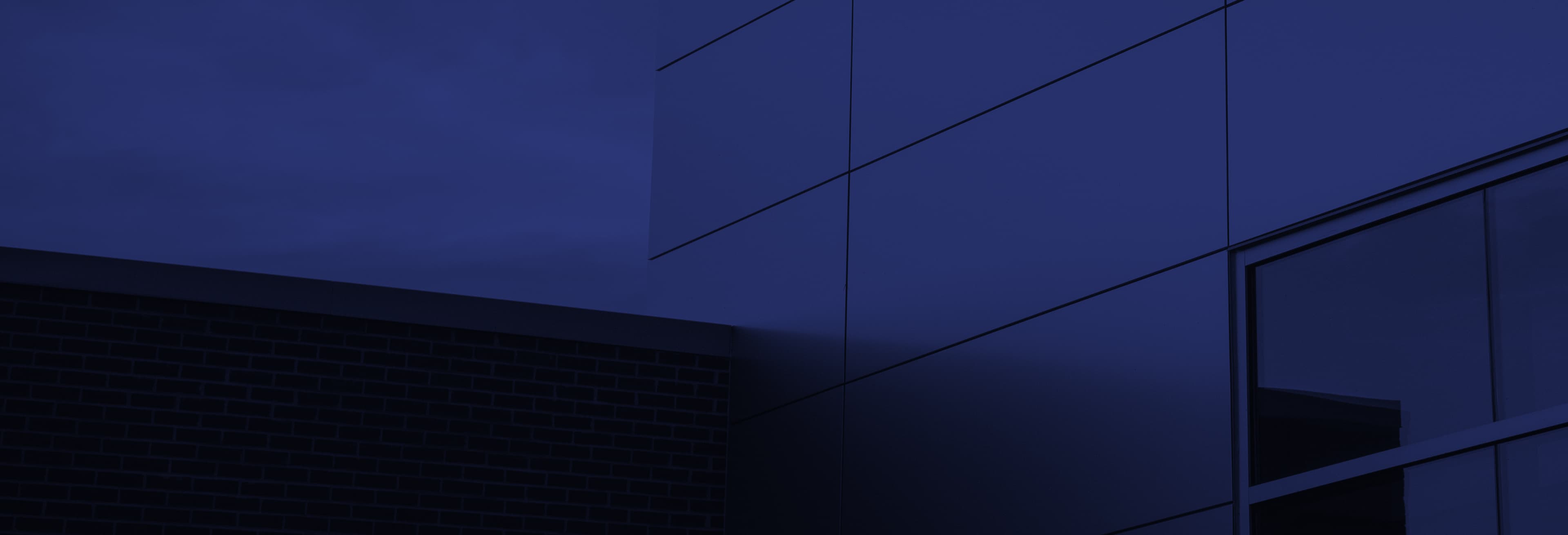 Sunset background over Witwer Construction IU Health facility.